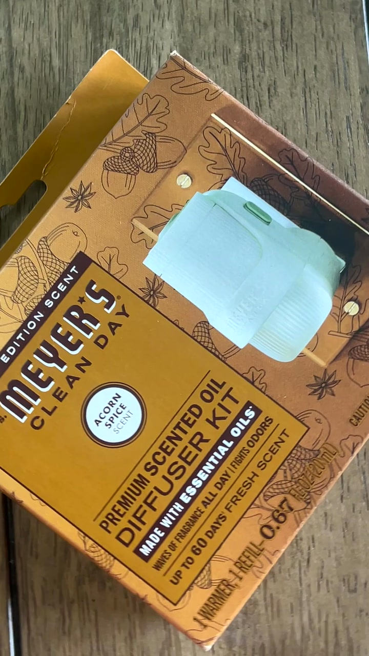Amazon package on a porch, the Mrs. Meyer's diffuser kit box inside